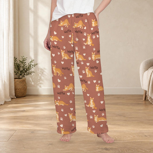 Domestic Shorthair personalized fleece pajama trousers on a model; women's fit, front view. Cozy neutral room background.