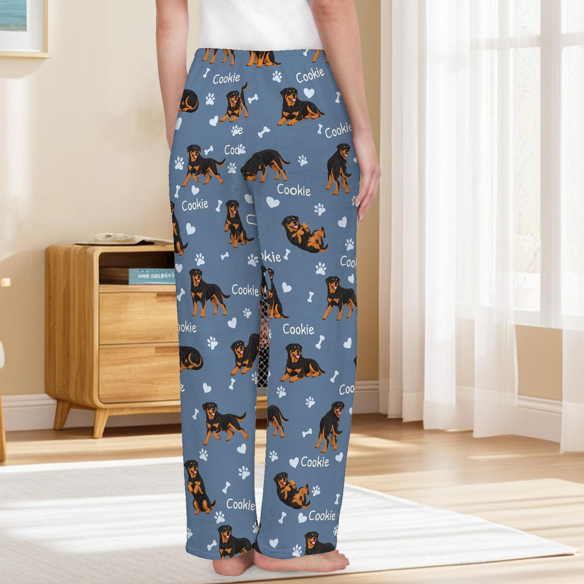 Rottweiler personalized pet name fleece pajama trousers, back lifestyle view.