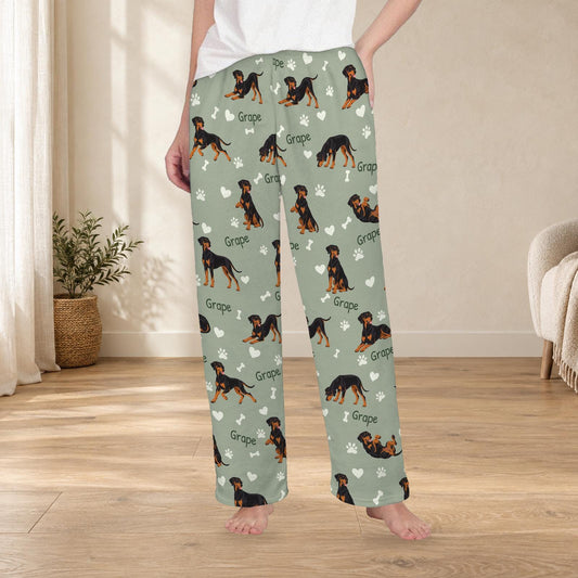 Doberman Pinscher personalized fleece pajama trousers on a model; women's fit, front view. Cozy neutral room background.