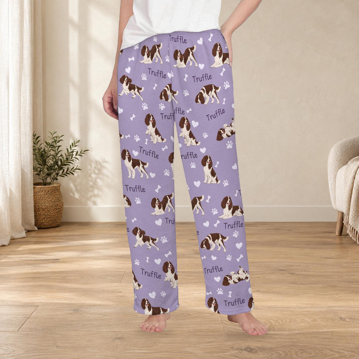English Springer Spaniel personalized fleece pajama trousers on a model; women's fit, front view. Cozy neutral room background.