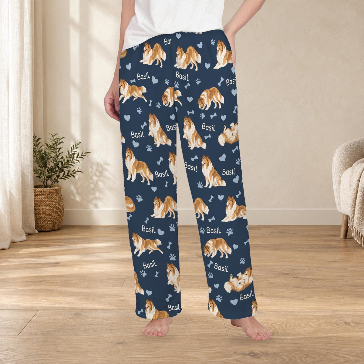 Collie personalized fleece pajama trousers on a model; women's fit, front view. Cozy neutral room background.