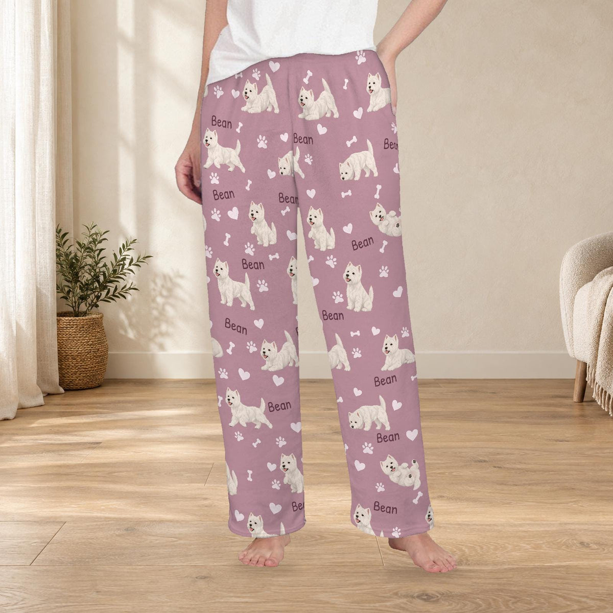 West Highland White Terrier personalized fleece pajama trousers on a model; women's fit, front view. Cozy neutral room background.