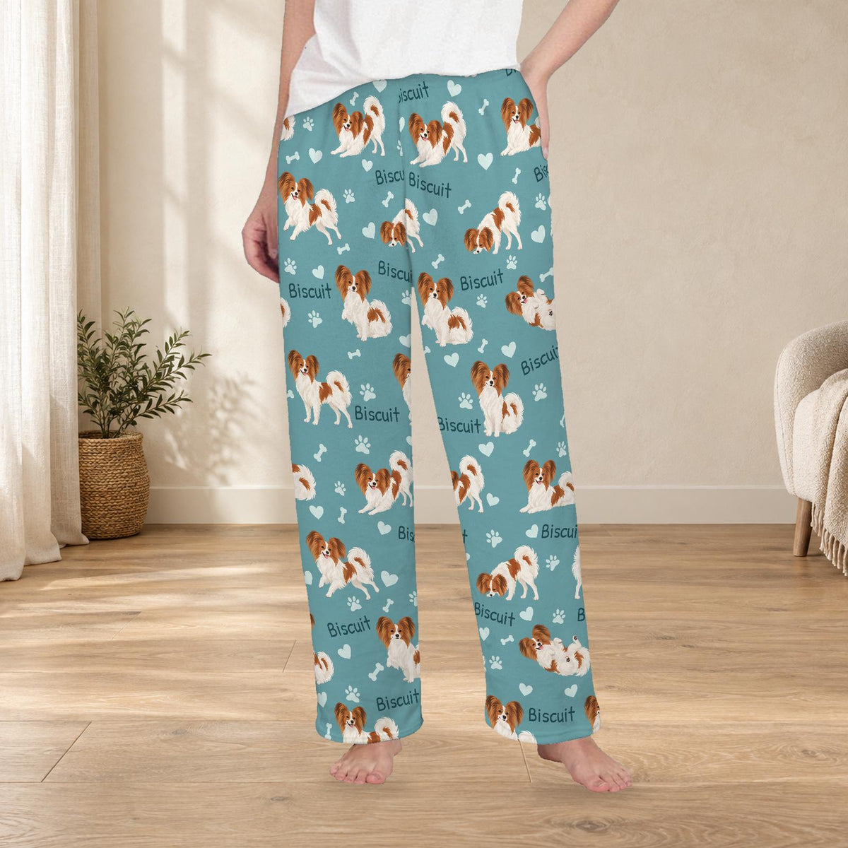 Papillon personalized fleece pajama trousers on a model; women's fit, front view. Cozy neutral room background.