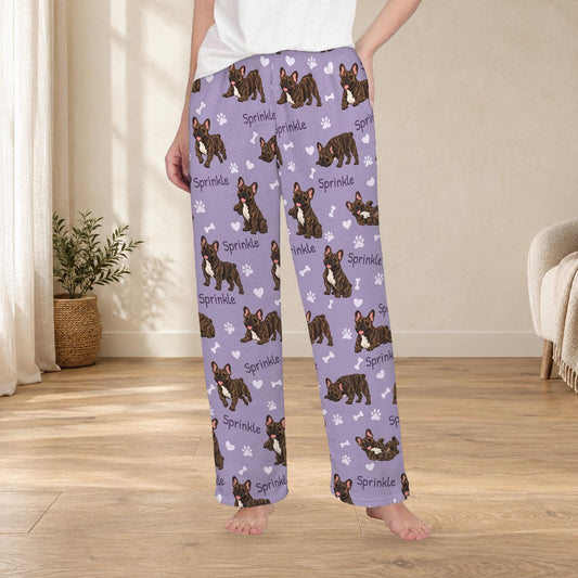 French Bulldog Brindle personalized fleece pajama trousers on a model; women's fit, front view. Cozy neutral room background.